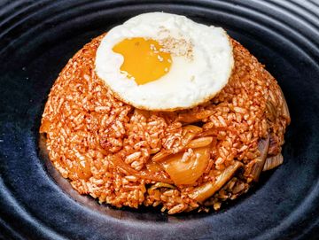 Kimchi fried rice with egg on top.