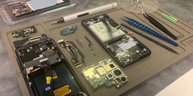 Android smartphone disassembled for repairs