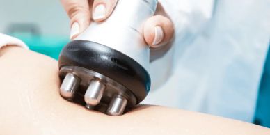 Close-up of a massage or therapy device on skin.