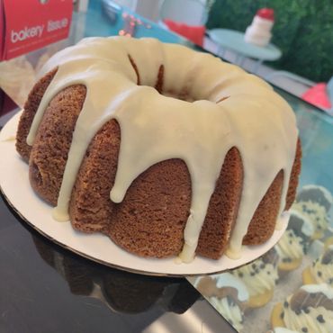 A brown colored cake with cream 