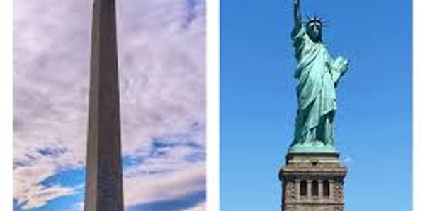 The Washington Monument and the Statue of Liberty under blue skies.