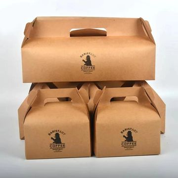 Stacked brown cardboard coffee takeaway boxes with handles and logos.