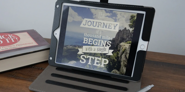Ipad displays a slogan  "The journey of a Thousand miles begin with a single step"