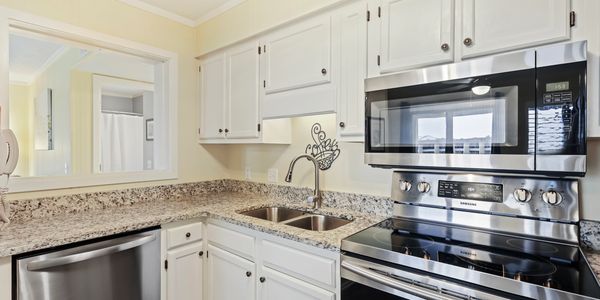 Renovated kitch with granite countertops and SS appliances