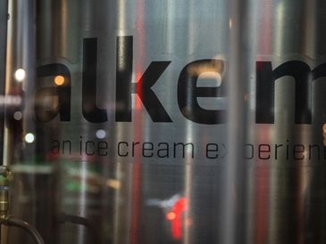 A tank viewed through a store window reflects the mood of the street presenting a mystery like that 