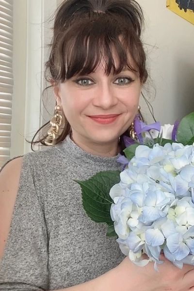 Elena Markin with bouquet of flowers