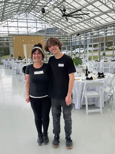 Elite Events BC - family owned company. Elena Markin & her son Nik Markin smiling at a wedding venue