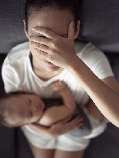 Mum feeling anxious sad worried with baby