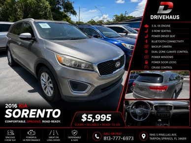 2016 Kia Sorento SUV parked outdoors, highlighted for sale features and price.