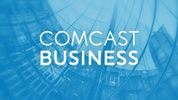 Comcast Business logo over a modern glass building background.