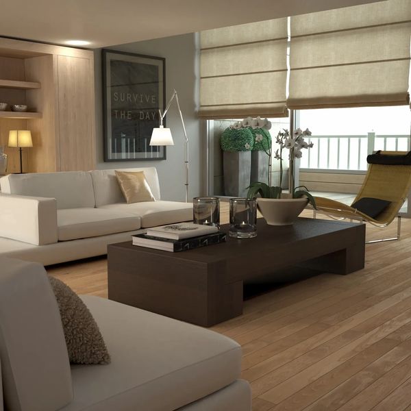 Sala moderna con sofá blanco y mesa de centro de madera.
