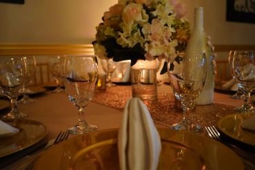 Elegant table setting with flowers and glassware.