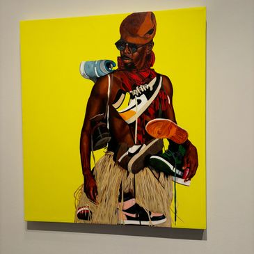 A vibrant painting of a man adorned with shoes and accessories against a yellow background.