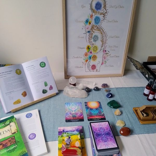 Teaching tools including manual, crystals and oracle cards  used during Reiki training in Adelaide
