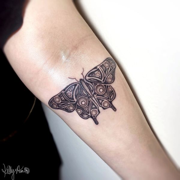 Detailed butterfly tattoo.