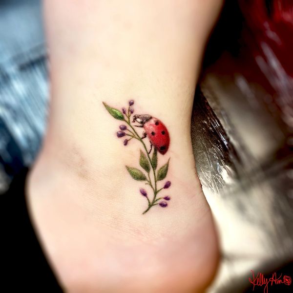 Colorful Ladybug tattoo.