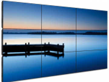 Serene lake with a dock at sunset.