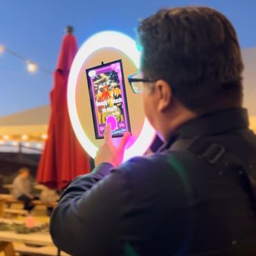 Roaming photo booth service being operated by the booth attendant at a private event rental