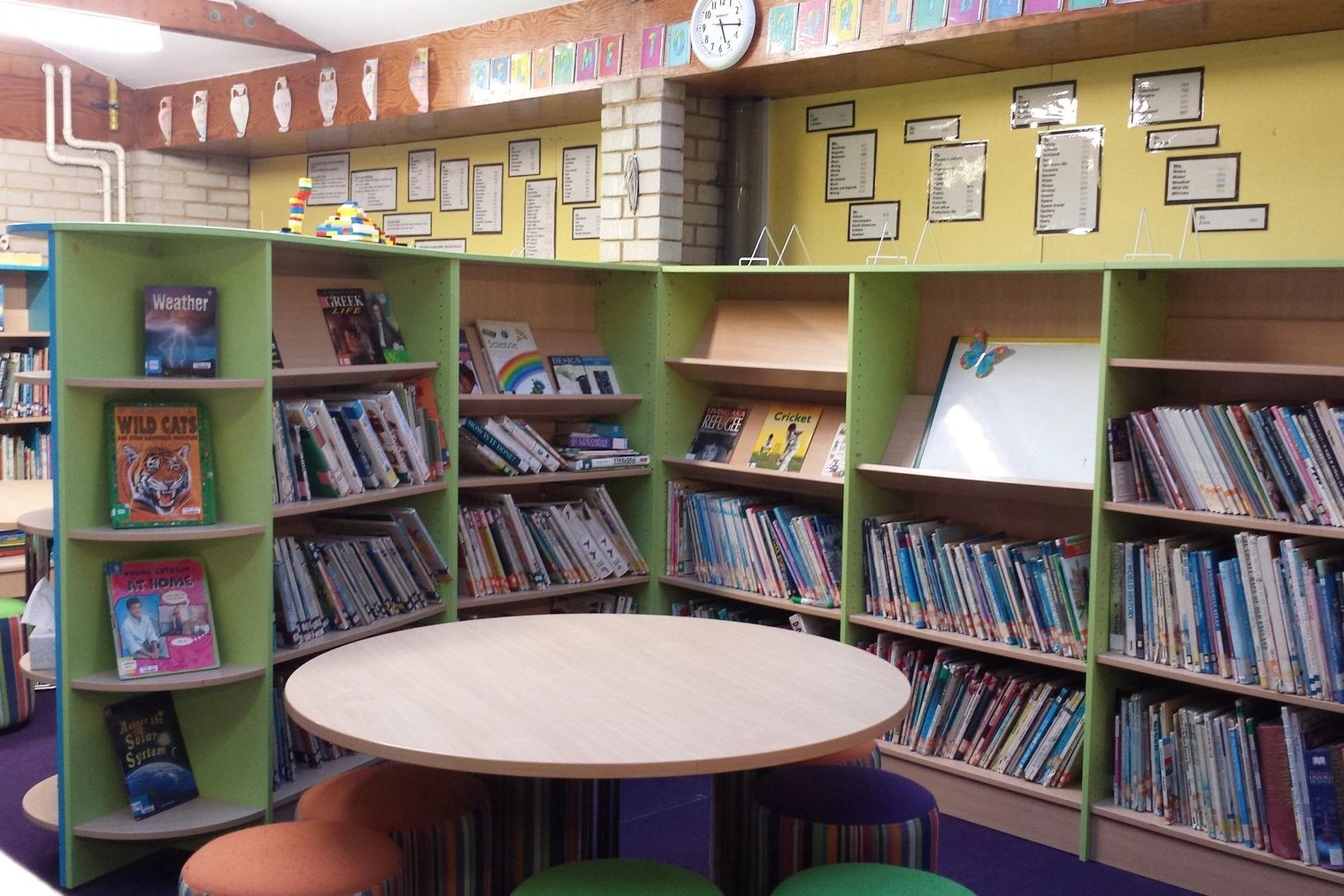 Finished interior carpentry with shelving and reading area in Shepherd’s Bush, London.