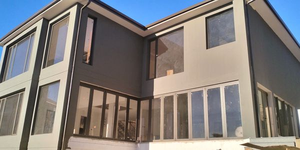 JLK Construction & Manufacturing  - Modern renovated house aluminium windows