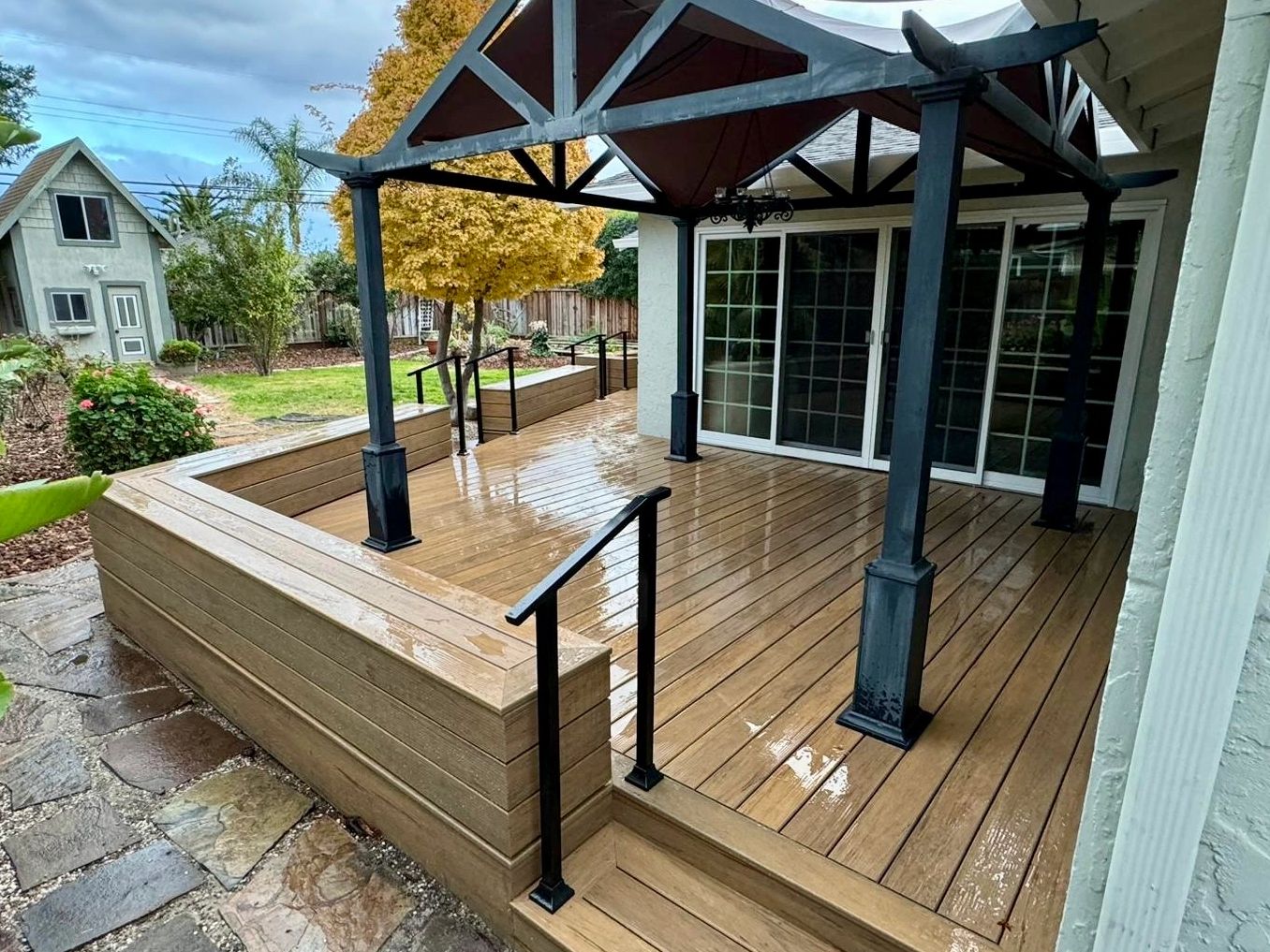 A composite deck with benches and a gazebo built over it. Painted and stained to match