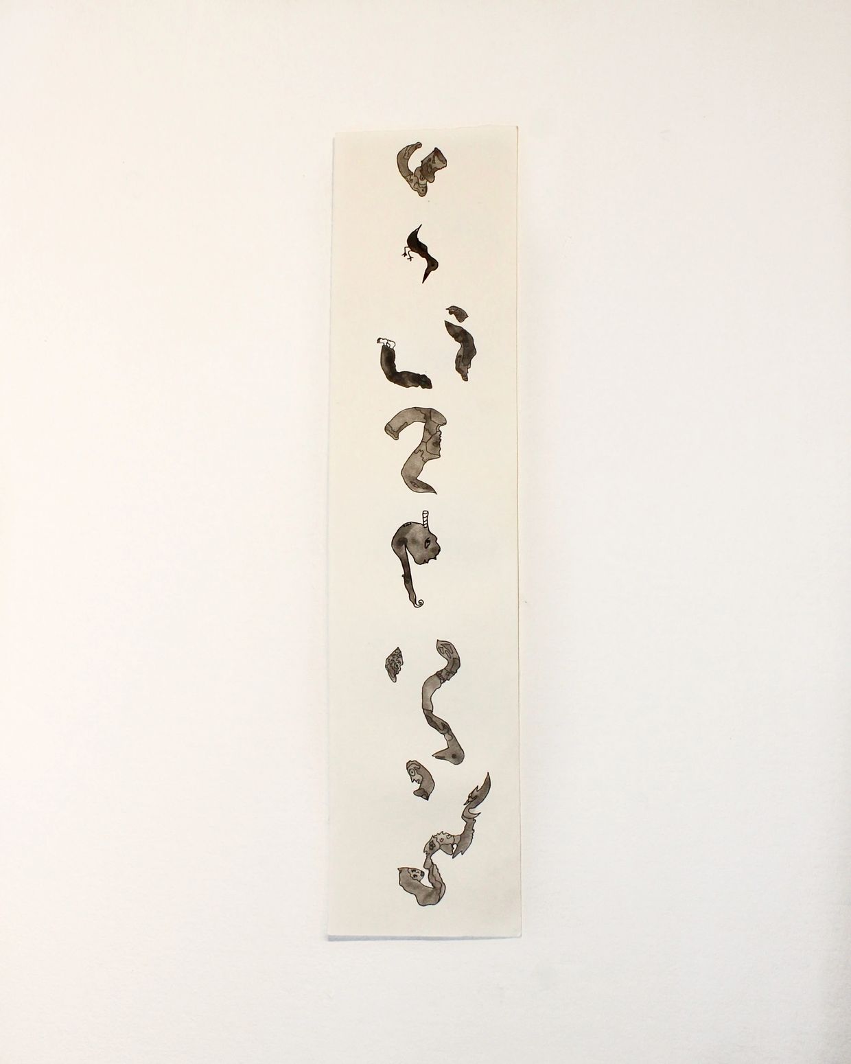 Abstract ink drawing with dark, organic shapes on a narrow white strip.