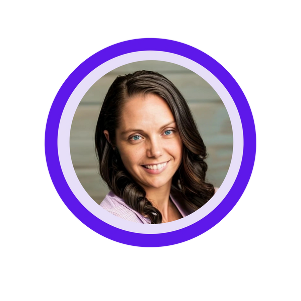 a woman smiling with dark brown hair and a purple shirt; Servant Heart Virtual Assistant