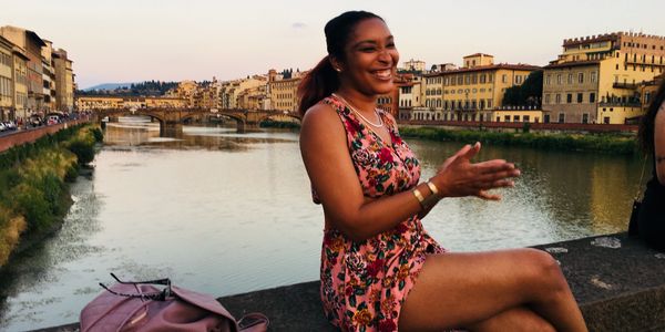 Chef sitting on Bridge in Florence, Italy