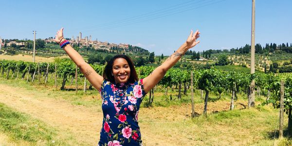 Chef standing in front of a Vineyard in Italy