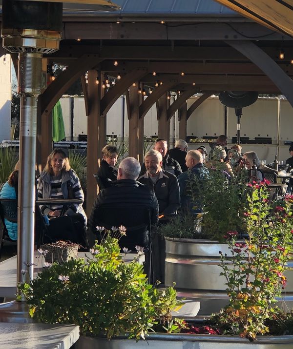 People eating and drinking on patio