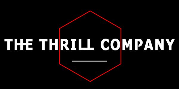 Logo of The Thrill Company with bold white text and a red hexagon.