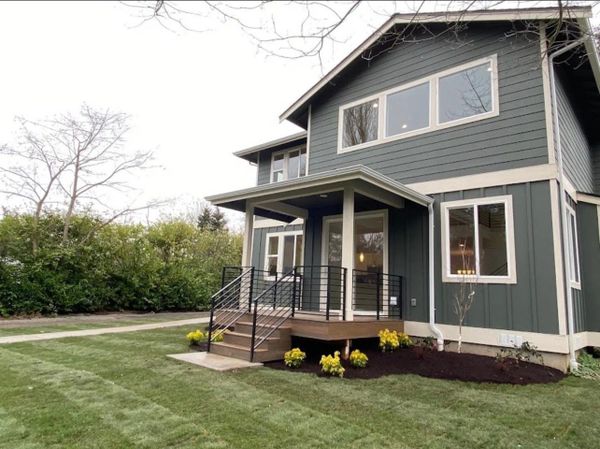 Wood work - deck, metal railing, new sod, planting, mulch, paver pathway. 
Mulkiteo, WA