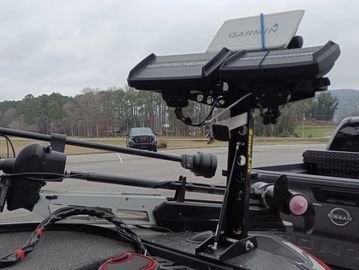 Garmin marine GPS device on a boat deck.