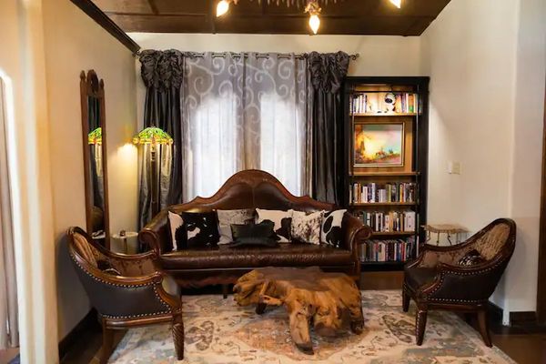 The living room boasts a $10,000 leather sofa that shouts "Welcome to Texas!"