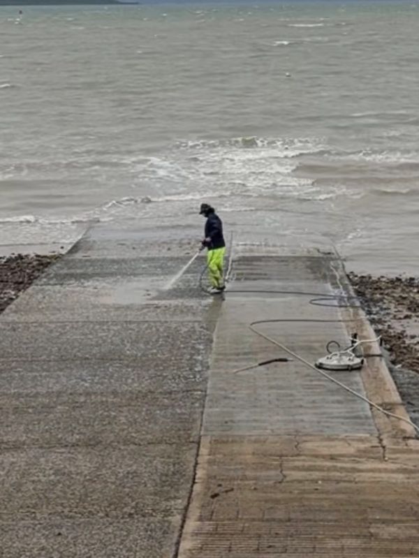 Marine boat ramp wash with high pressure. Commercial equipment. 