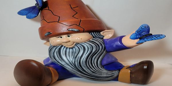 Gnome sitting with Butterflies 