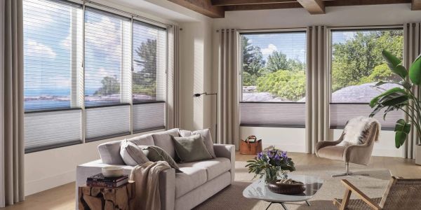 Bright living room with large windows and modern furniture.