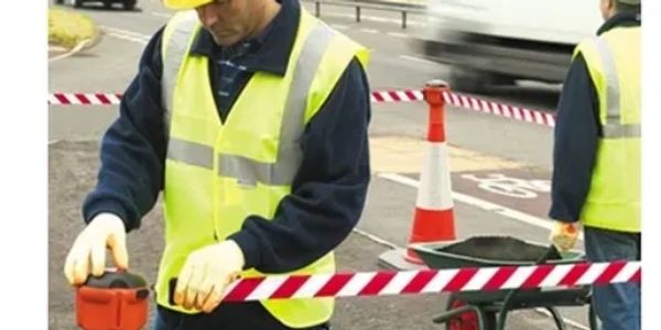 Securing a work area with safety barriers.