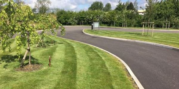 Maintaining grass verges and other vegetation on a commercial site.