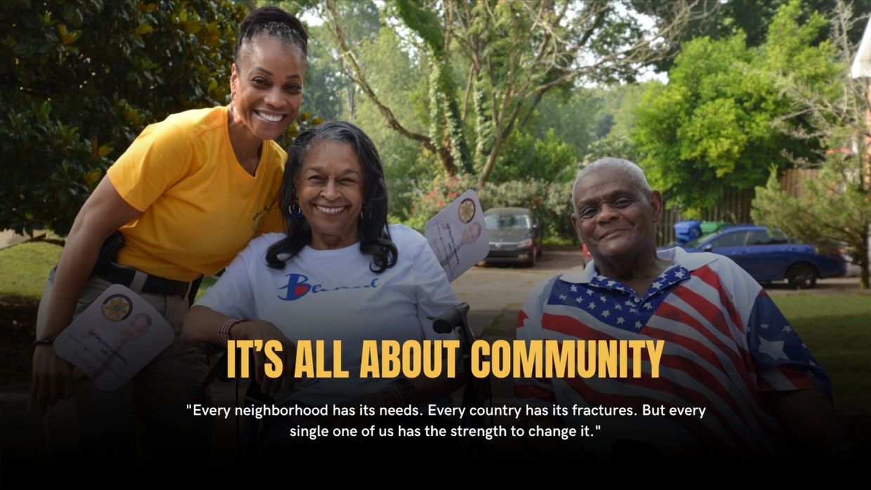 Three people smiling outdoors with community-themed text.