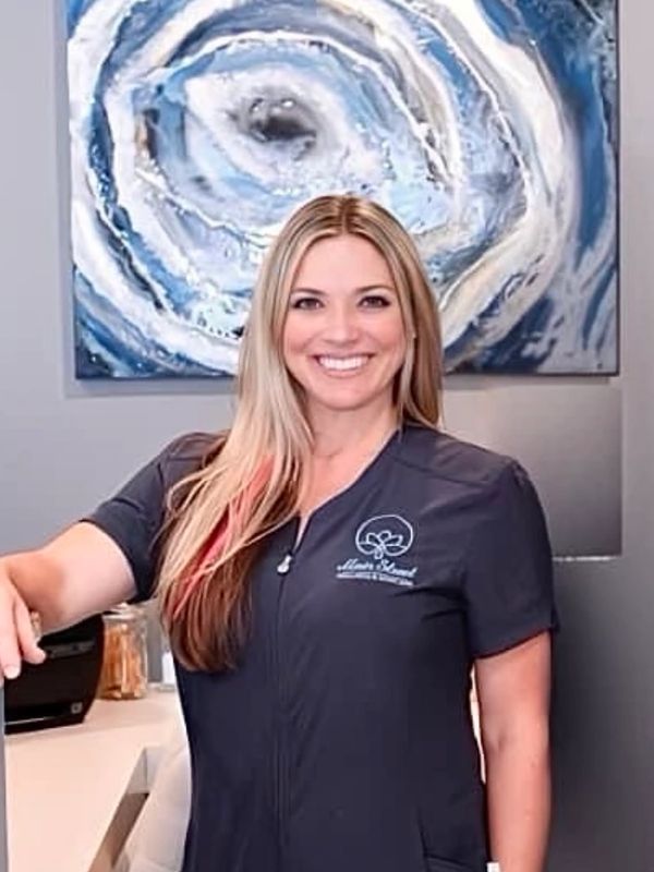 Owner of main street wellness and skincare spa, standing in spa facility