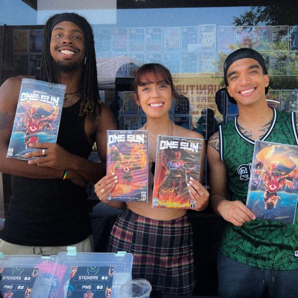 Blaze Ho'omakoa, Malik Rashaan, and Kattia Melendrez selling the first print of One Sun Chapter 1.