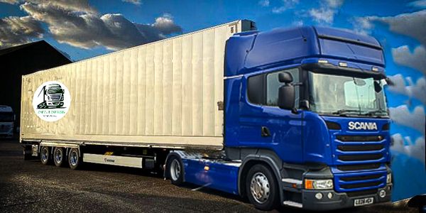 Blue Scania tractor unit pulling a megacube trailer for events and festivals