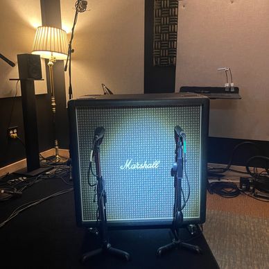 Park the Marshall Model 10960BX 100w Lead 4x12" Cabinet with 25 watt greenbacks in the booth.
Mic it