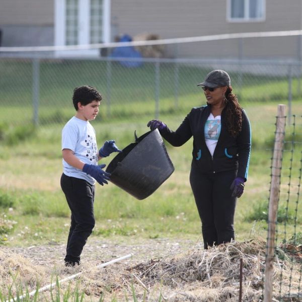 Adrienne handing basket to child 