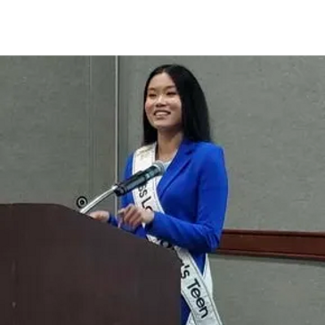 Miss Teen Louisiana speaking before the LASTEM Advisory Council at a podium.