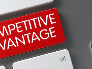 Red key labeled 'Competitive Advantage' next to a keyboard.