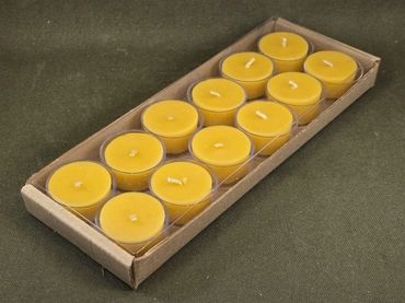 A pack of yellow tealight candles in a cardboard tray.