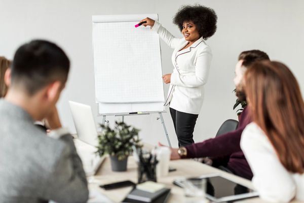 Image by freepik - women making presentation