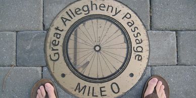 Mile 0 medallion on the Great Allegheny Passage at Canal Place in Cumberland, MD
